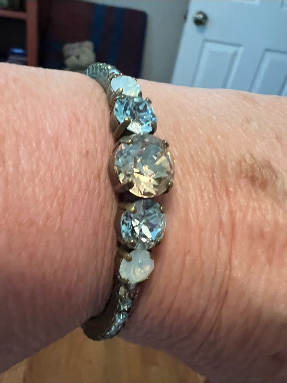 Crystal cuff bracelet, Sorrelli brand
Blue and light amber stones